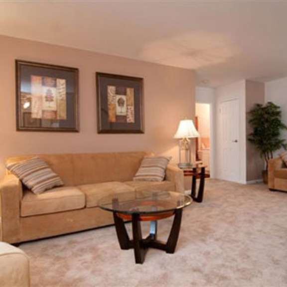 a living room with a couch and a table