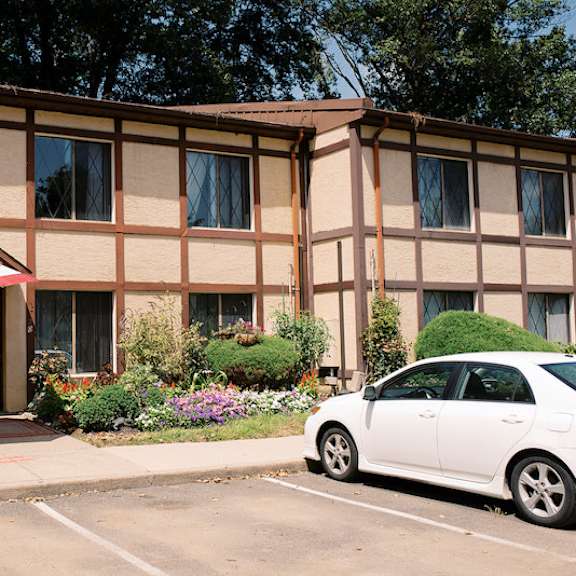 a building with a white car parked in front of it