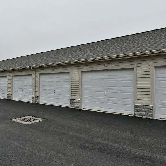 a large white building with white garage doors