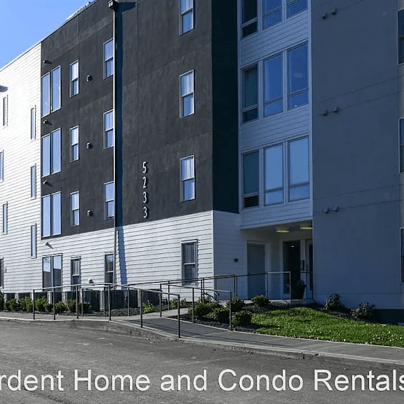 a view of the front of a building with the words ardent home and condo rentals