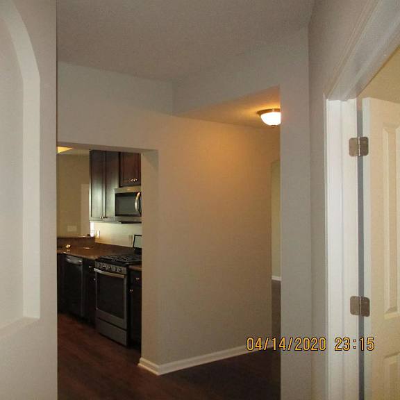 a view of a kitchen from the living room