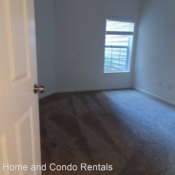a blurry image of a bedroom with a window