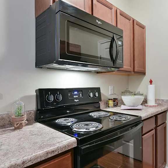 a kitchen with a stove and a microwave