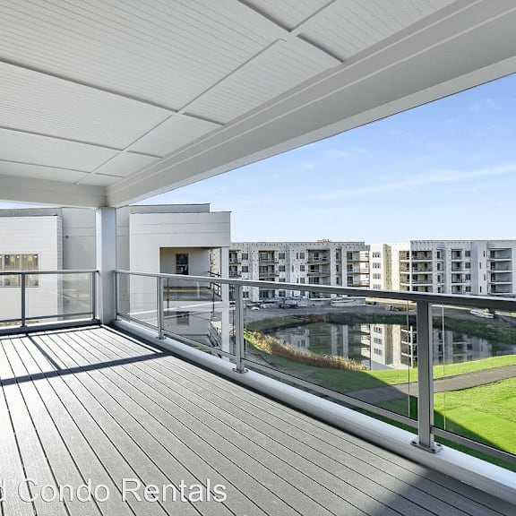 a balcony with a view of a city and a river