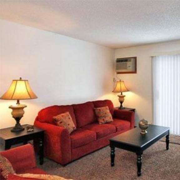 a living room with a couch and a table