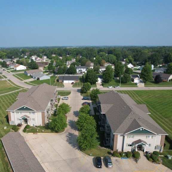 an aerial view of a neighborhood with houses and lawns