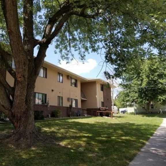 a large building with a tree in front of it