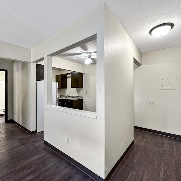 a room with a mirror and a light fixture on the ceiling.