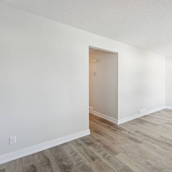 a room with a wooden floor and a door.