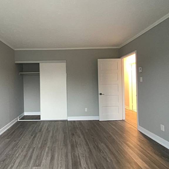 a room with a white door and a white closet.