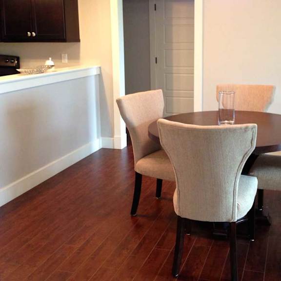a dining room with a table and chairs.