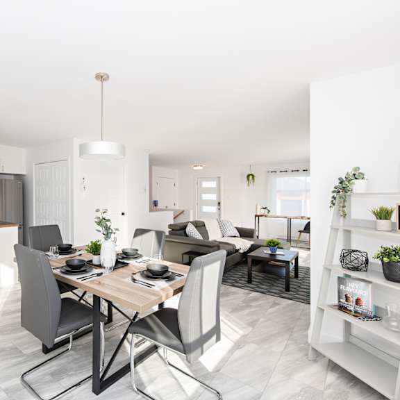 a modern kitchen with a dining table and chairs.