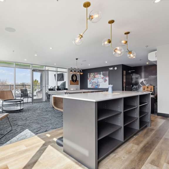 a modern living room with a grey sofa and a wooden coffee table.