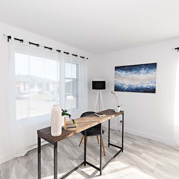 a room with a table and chairs and a painting on the wall.