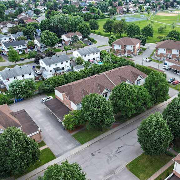 a residential area with houses and a park.