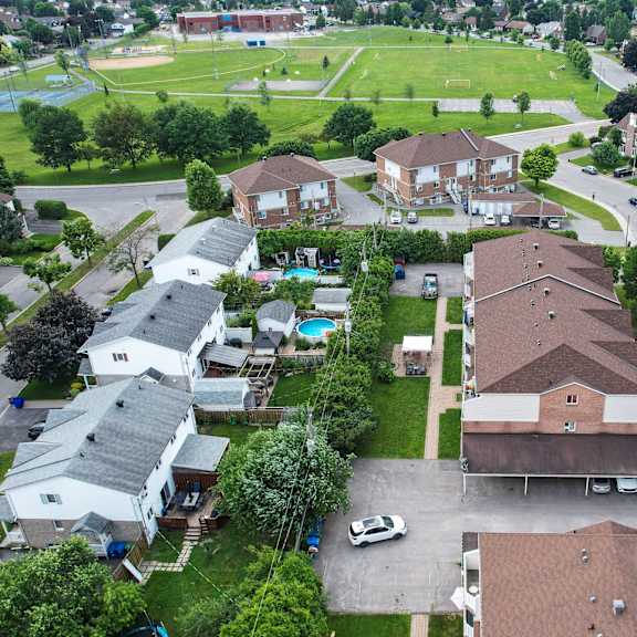 a residential area with houses and a park.