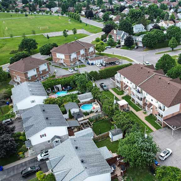 a residential area with houses and a park.