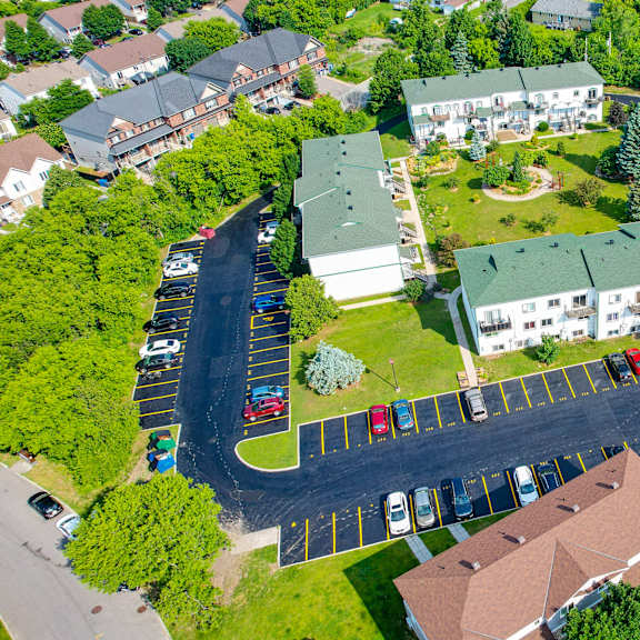 a bird's eye view of a residential area with houses and cars.