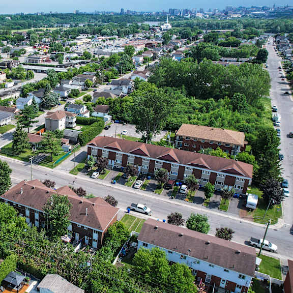 a residential area with houses and greenery.