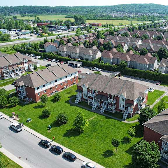 a large housing complex with a road running through it.