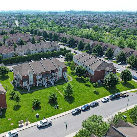 a bird's eye view of a residential area with houses and cars.