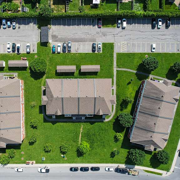 a residential area with houses and parked cars.