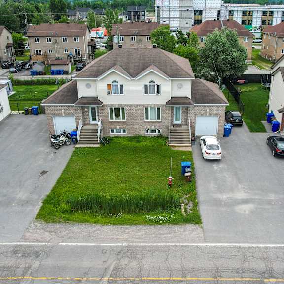 a residential area with houses and cars.