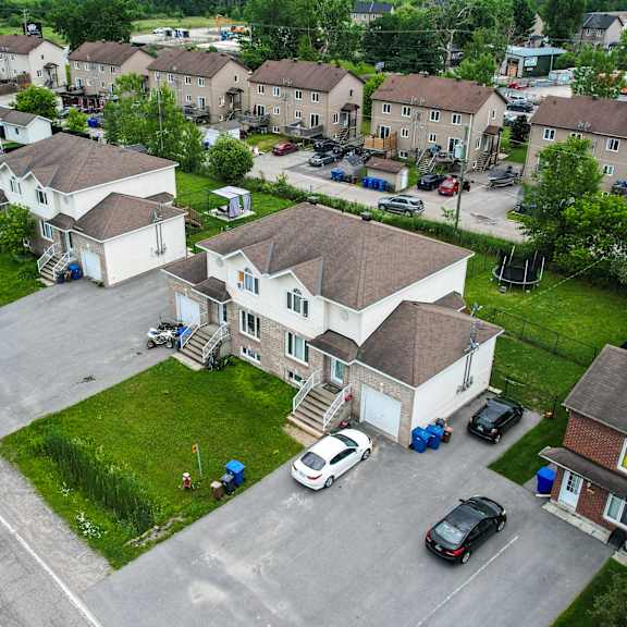 a residential area with houses and cars.