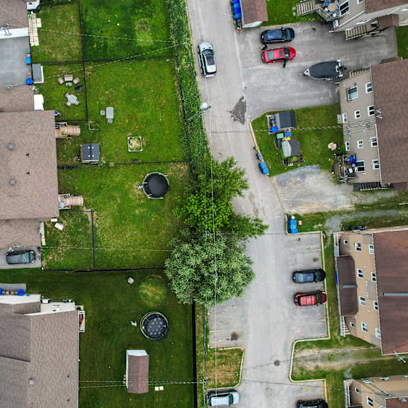 a residential area with houses and cars.