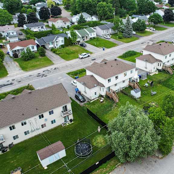 a residential area with houses and cars.