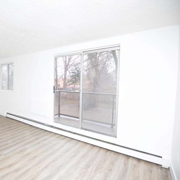 a room with a window and a door.
