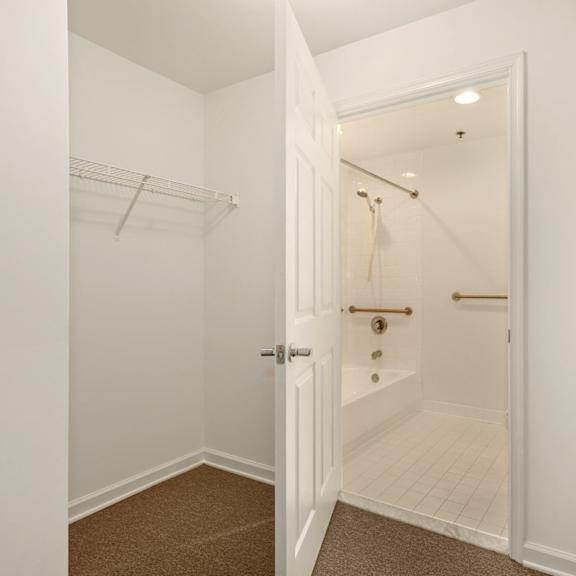 a white bathroom with a walk-in shower.