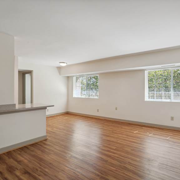 a room with wooden floors and a window.