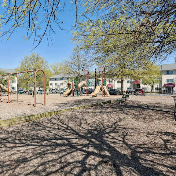 a playground with swings and a slide.