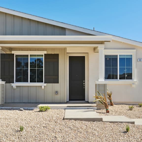a house with black front door at montessa apartments, vacaville