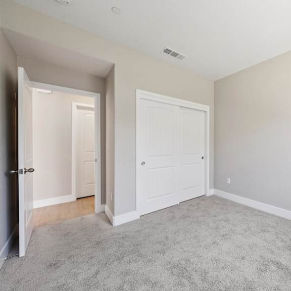 a room with a white door at montessa apartments, vacaville