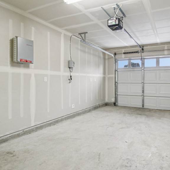 a garage with a white door and a window.