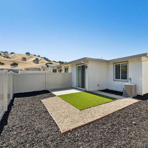 a modern house with a backyard at montessa apartments, vacaville, california