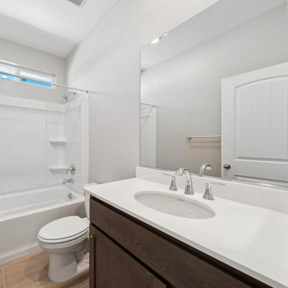 a white bathroom with a toilet at montessa apartments, vacaville, ca, 95687