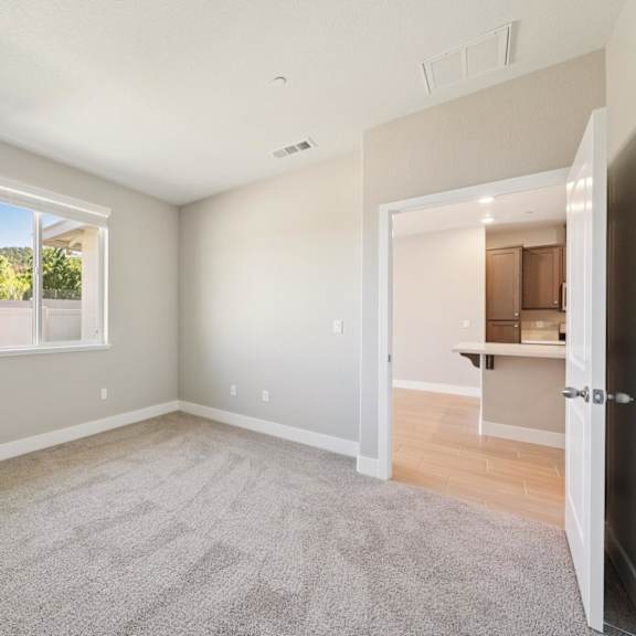 a room with a carpeted floor at montessa apartments, california, 95687