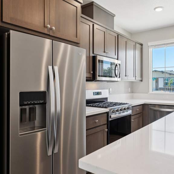 a kitchen with a window at montessa apartments, california