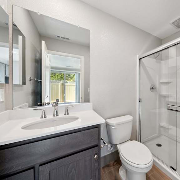 walk-in showers with glass enclosure at montessa apartments, california, 95687