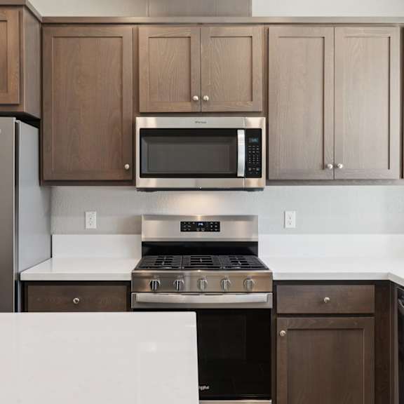 a kitchen with a microwave at montessa apartments, vacaville, ca