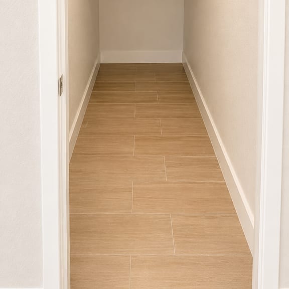 a long hallway with a light on the ceiling.