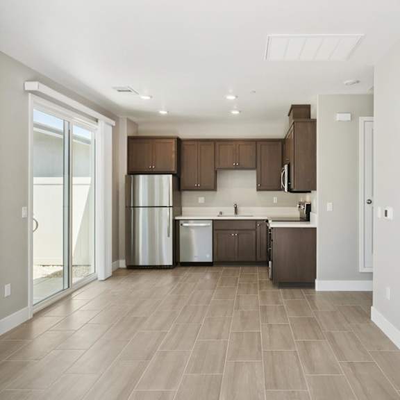 fully furnished kitchen with stainless steel appliances at montessa apartments, vacaville