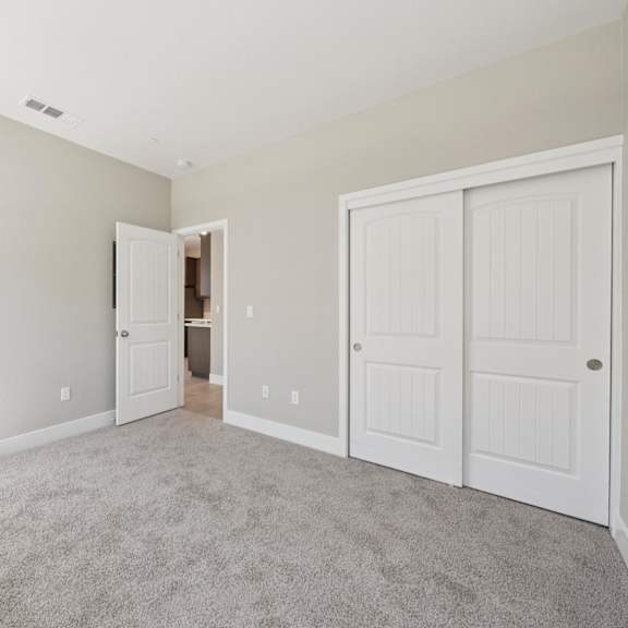a room with a closet at montessa apartments, california, 95687