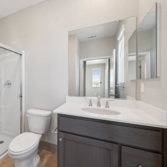 bathroom with storage space at montessa apartments, california, 95687
