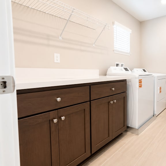 a laundry room with a washer and dryer.