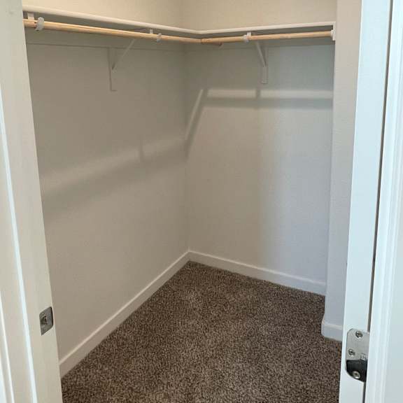 a white drawer is open in a cabinet.