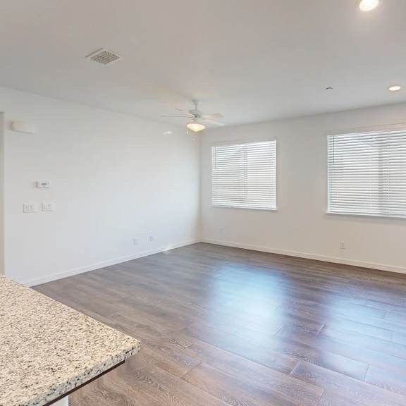 a room with a carpet and wooden flooring.